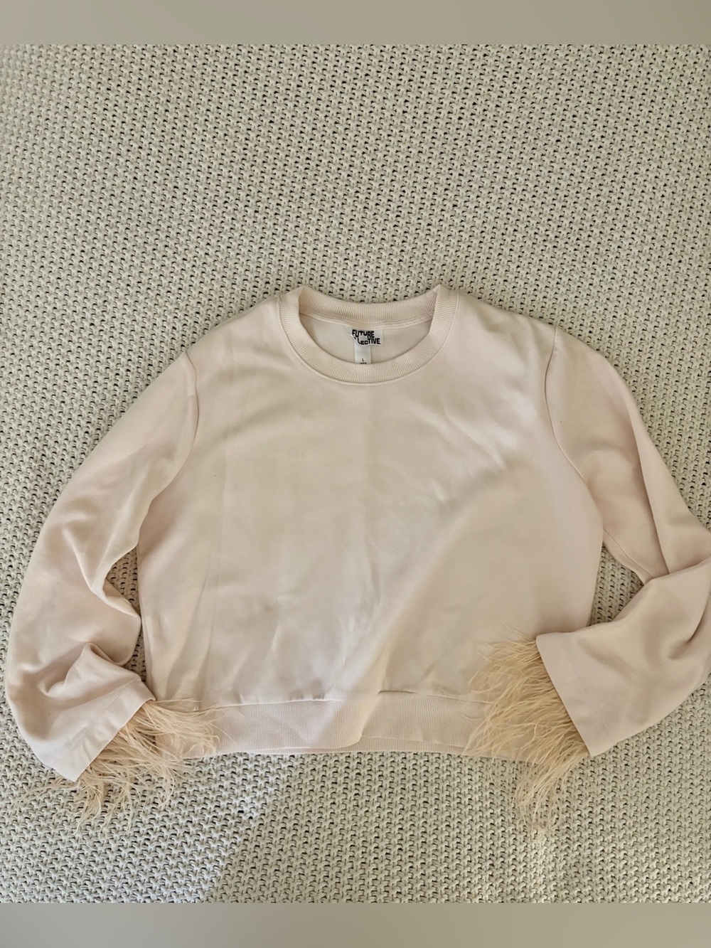 Future Collective women’s blush pink crewneck sweatshirt with feather trim cuffs